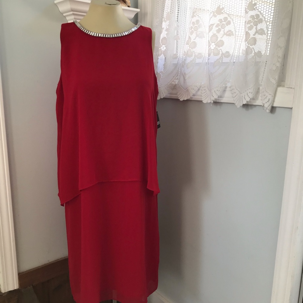 MSK sleeveless sheath with sheer, tiered overlay.